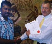 Mervyn Govender (left) thanks Johan van der Westhuizen after the presentation.